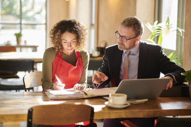 Certified public accountant tracking financial ledgers
